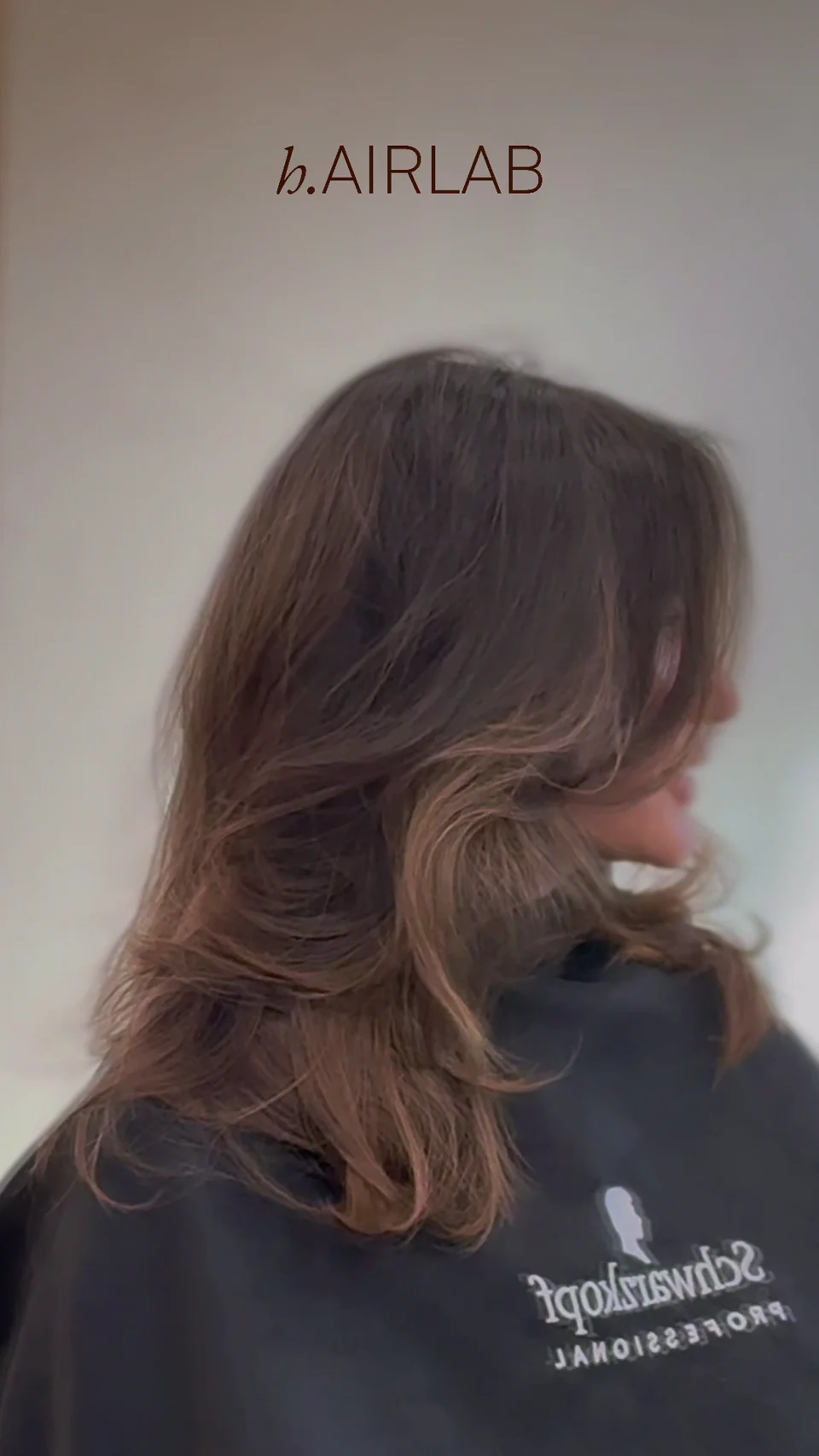 Glossy brunette hair with a smooth, flowing finish